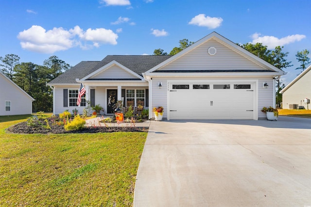 view of front of house with cooling unit, a front lawn, a porch, and a garage