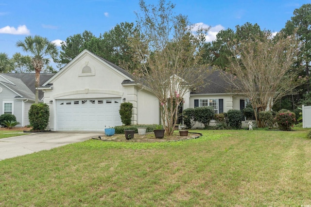 single story home with a garage and a front lawn