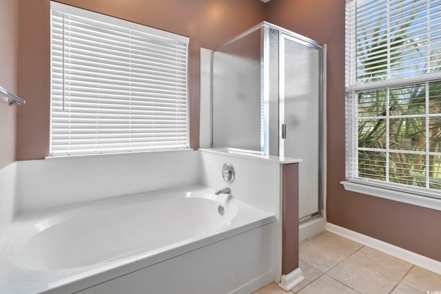 bathroom with tile patterned flooring and plus walk in shower