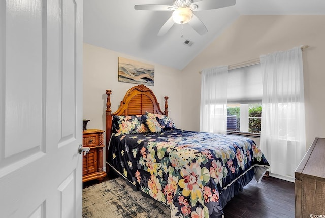 bedroom featuring dark wood-type flooring, ceiling fan, and vaulted ceiling