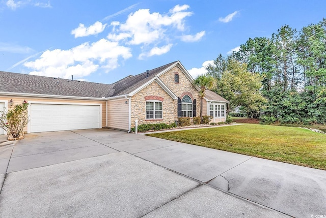 view of front of house with a garage and a front yard