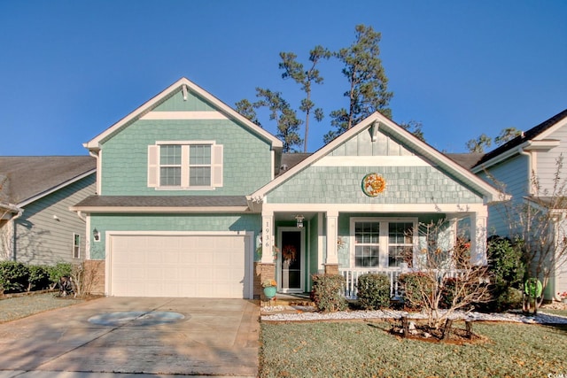 craftsman-style home with covered porch and a garage