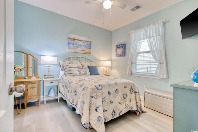 bedroom featuring hardwood / wood-style flooring and ceiling fan