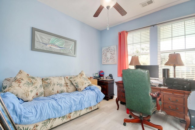 office area with ceiling fan and light hardwood / wood-style flooring