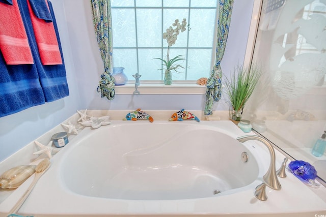 bathroom with a tub to relax in