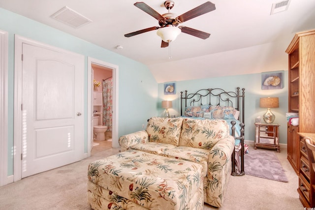 carpeted bedroom featuring ceiling fan, connected bathroom, and vaulted ceiling