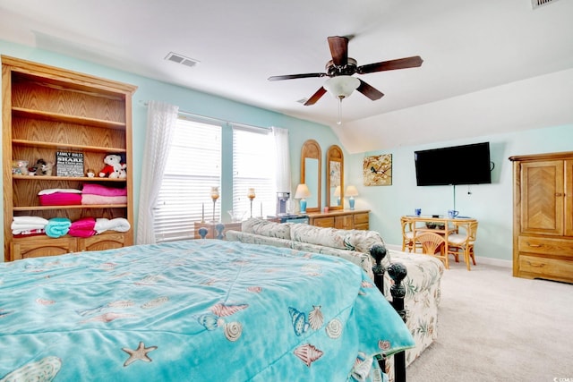 carpeted bedroom featuring ceiling fan and vaulted ceiling