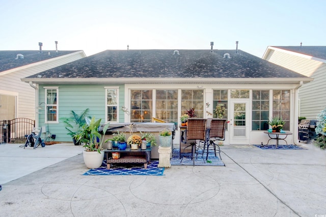 back of house with a patio