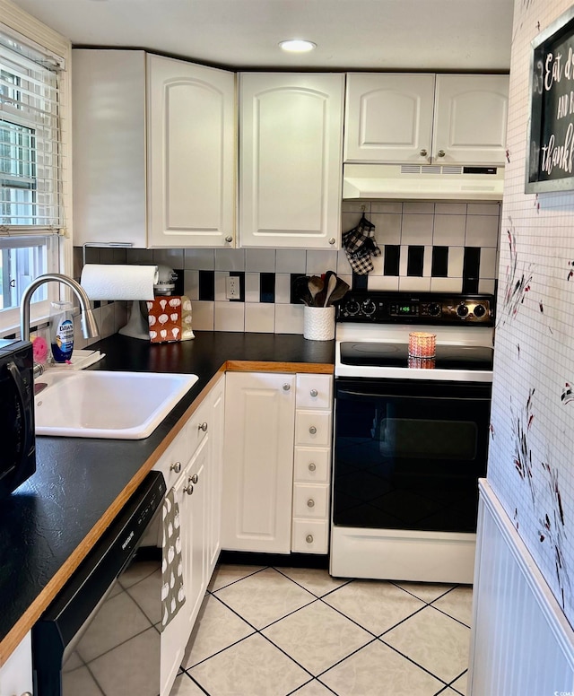 kitchen with white cabinets, black dishwasher, electric range, backsplash, and sink