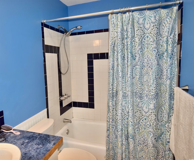 full bathroom featuring toilet, shower / bath combo, and vanity