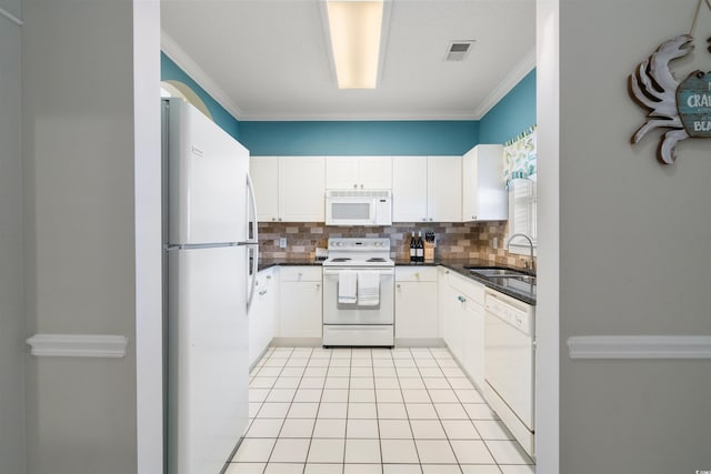 kitchen with backsplash, sink, white cabinetry, and white appliances