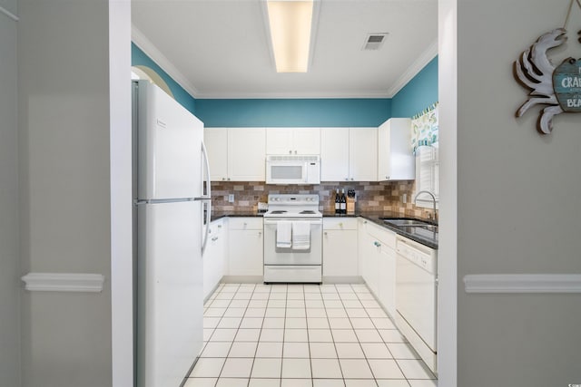 5750 Oyster Catcher Dr Unit 1134, North Myrtle Beach, SC 29582 - kitchen featuring tasteful backsplash, crown molding, a sink, dark countertops, and white appliances