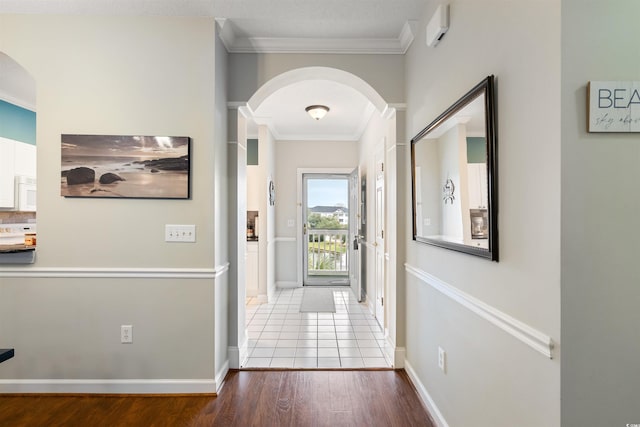 5750 Oyster Catcher Dr Unit 1134, North Myrtle Beach, SC 29582 - corridor featuring baseboards, arched walkways, wood finished floors, and crown molding