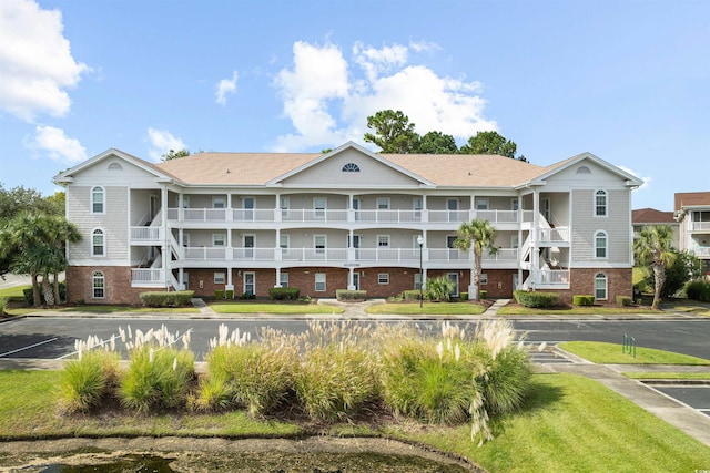5750 Oyster Catcher Dr Unit 1134, North Myrtle Beach, SC 29582 - view of building exterior with uncovered parking