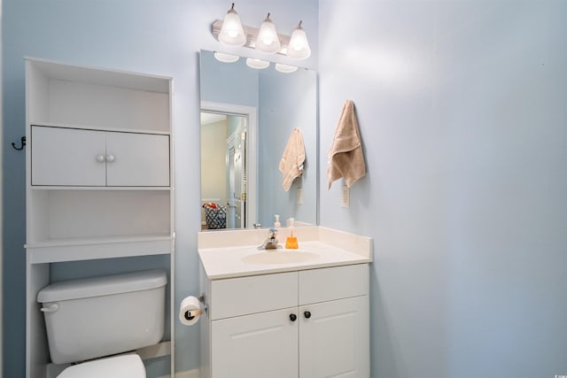 bathroom with toilet and vanity