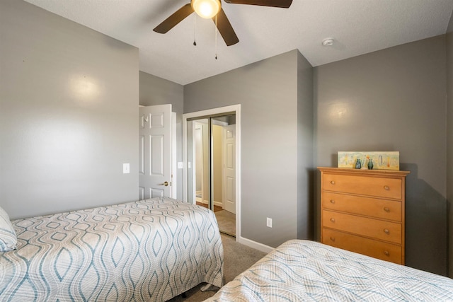 carpeted bedroom featuring ceiling fan and vaulted ceiling