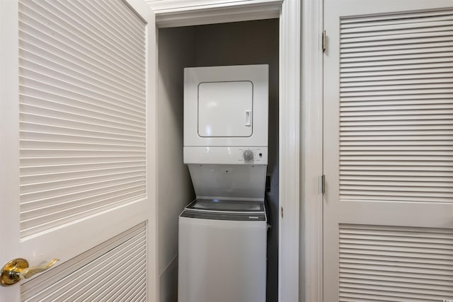 washroom with stacked washer / drying machine