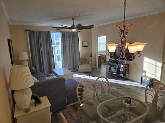 living room with crown molding, hardwood / wood-style floors, and a wealth of natural light