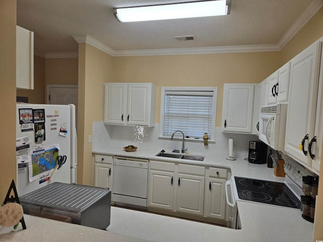 kitchen with ornamental molding, sink, white cabinets, and white appliances