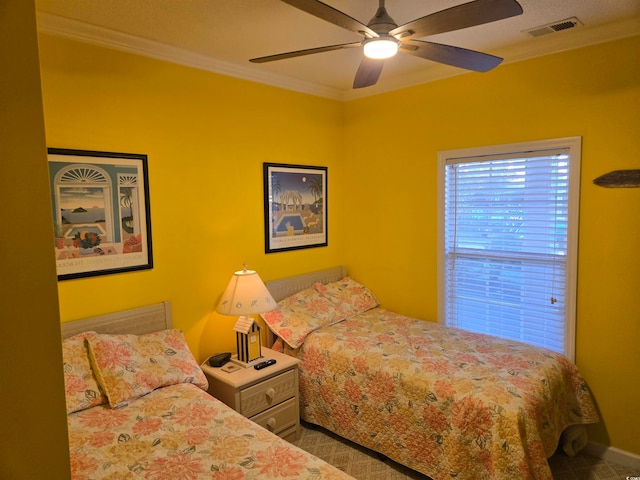 bedroom featuring crown molding and ceiling fan