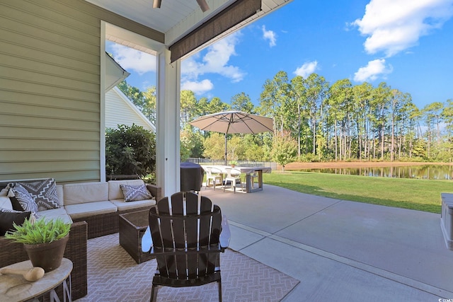 view of patio / terrace with a water view and an outdoor hangout area