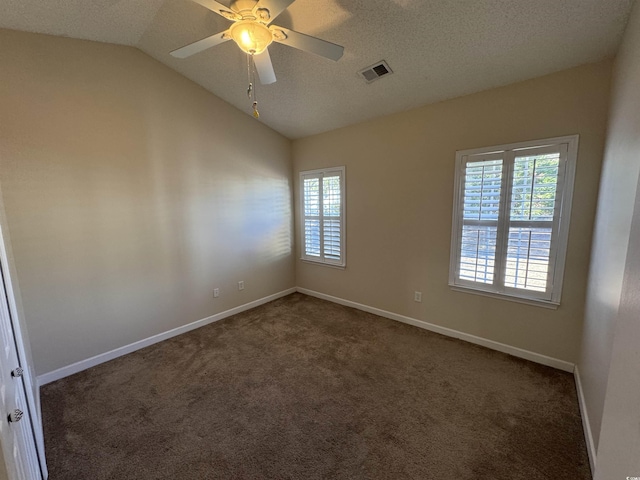 carpeted empty room featuring ceiling fan, a textured ceiling, and vaulted ceiling