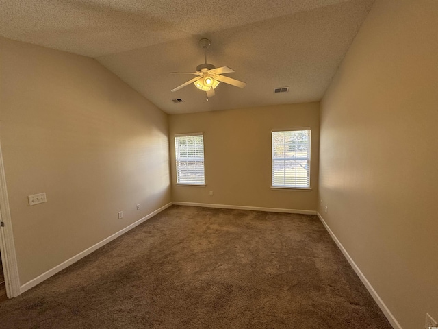 unfurnished room with a textured ceiling, ceiling fan, carpet flooring, and lofted ceiling