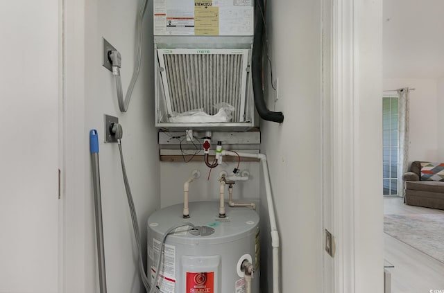 utility room featuring water heater