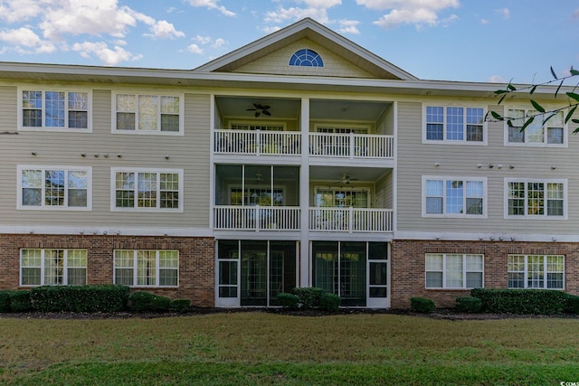 exterior space featuring a yard and a balcony