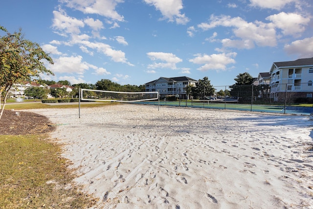 surrounding community with tennis court and volleyball court