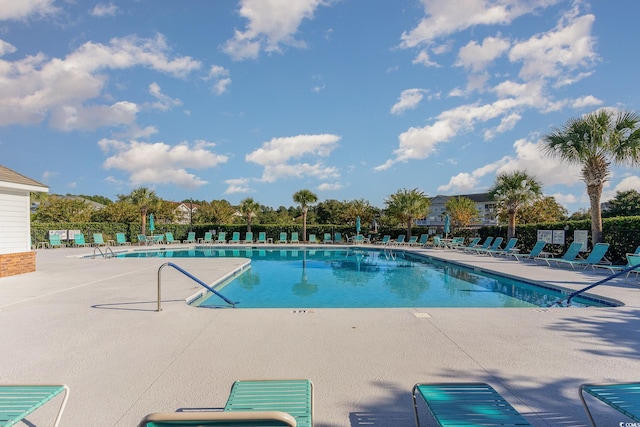 view of swimming pool with a patio area