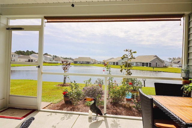 sunroom with a water view