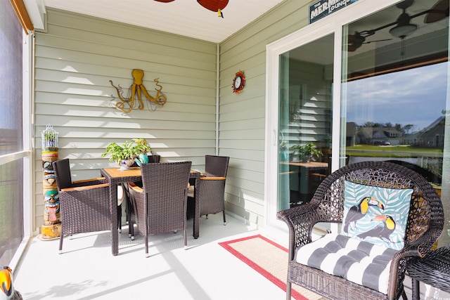 exterior space featuring ceiling fan