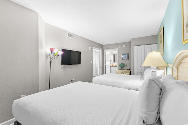 2701 S Ocean Blvd Unit 1817, North Myrtle Beach, SC 29582 - bedroom featuring baseboards and connected bathroom