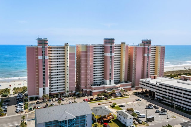 aerial view featuring a water view and a view of the beach