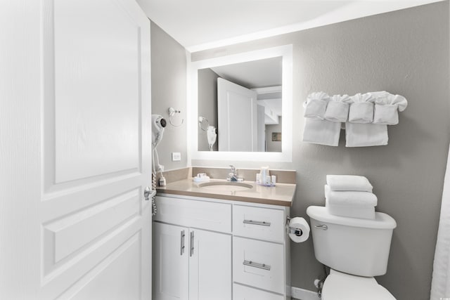 2701 S Ocean Blvd Unit 1817, North Myrtle Beach, SC 29582 - half bathroom with vanity and a textured wall