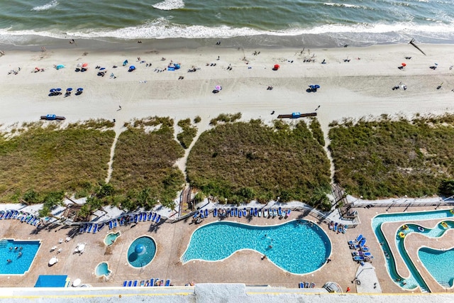 bird's eye view with a water view and a view of the beach