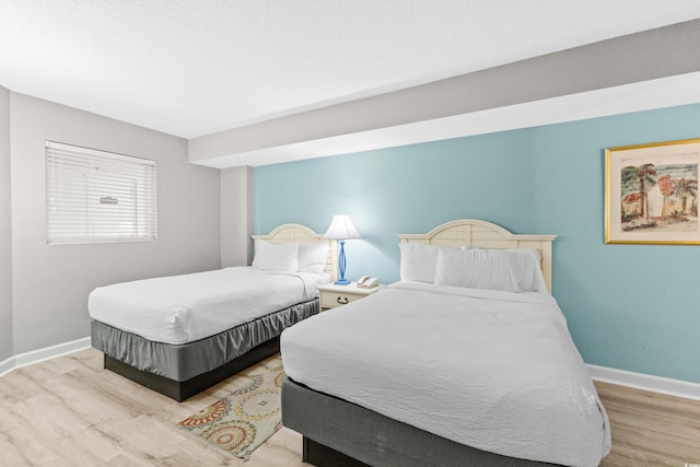 bedroom with light hardwood / wood-style flooring