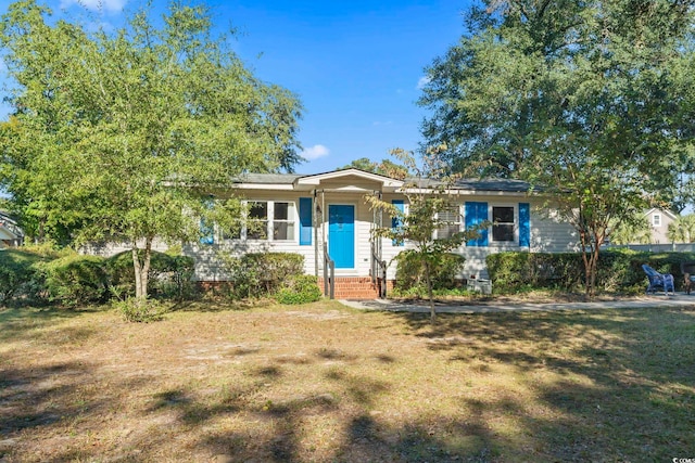 ranch-style house with a front lawn