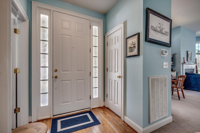 foyer entrance with light wood-type flooring