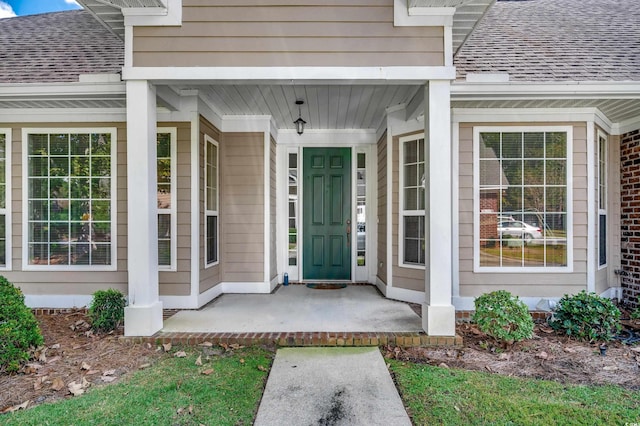 entrance to property featuring covered porch