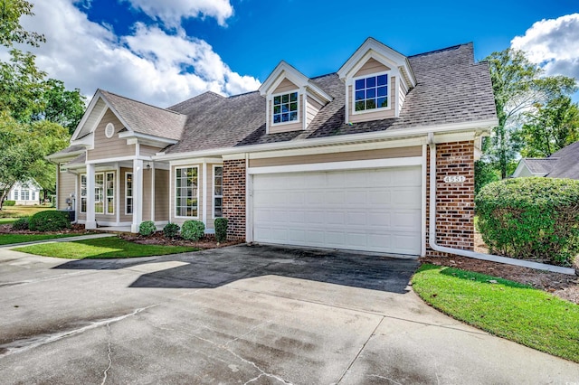 cape cod house featuring a garage