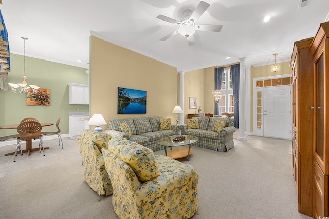 living room featuring ceiling fan, ornamental molding, light carpet, and ornate columns