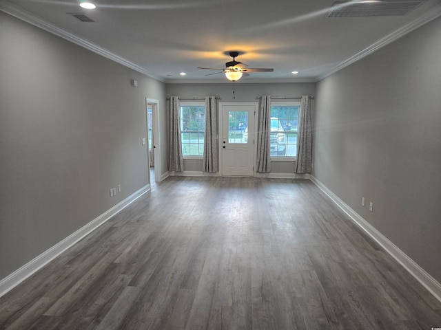 empty room featuring ceiling fan, ornamental molding, and dark hardwood / wood-style floors