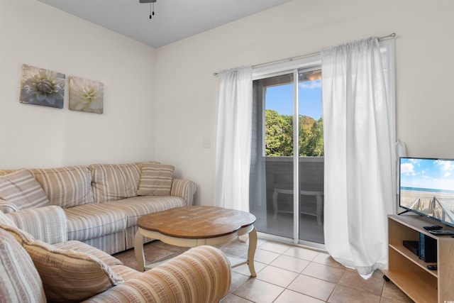 tiled living room with ceiling fan