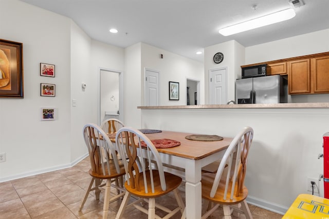 dining room featuring light tile patterned flooring