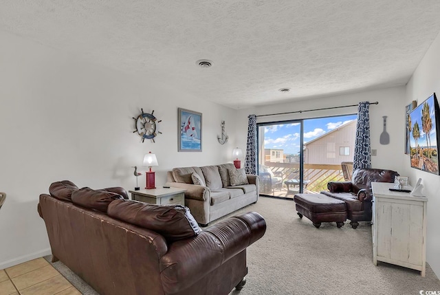 living room with light carpet and a textured ceiling