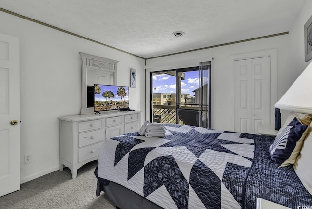 9621 Shore Dr Unit G219, Myrtle Beach, SC 29572 - bedroom featuring light colored carpet, access to exterior, and a textured ceiling