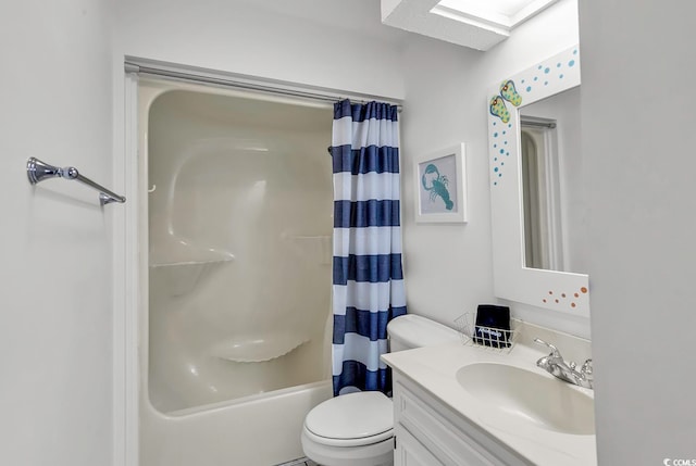 full bathroom featuring toilet, shower / tub combo with curtain, vanity, and a skylight