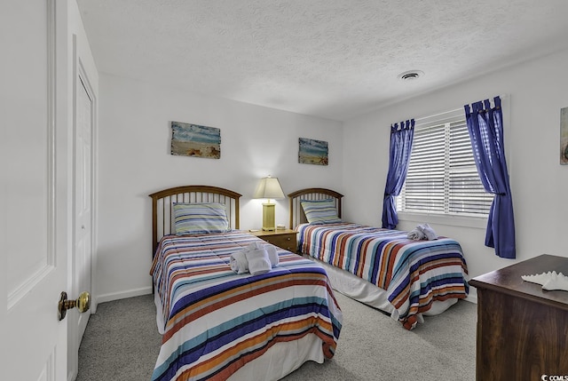 9621 Shore Dr Unit G219, Myrtle Beach, SC 29572 - carpeted bedroom with a textured ceiling and a closet